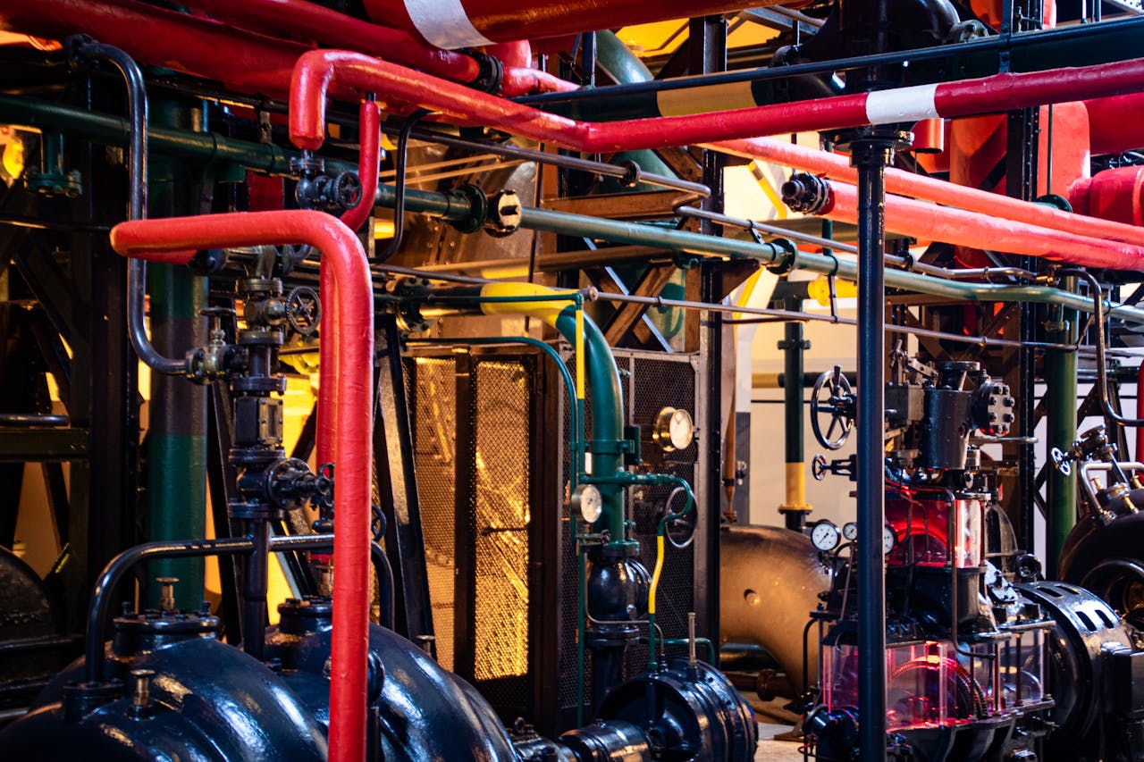 Home Complex network of industrial pipes and machinery inside a Lisbon plant.